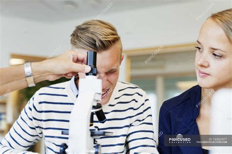 University student using microscope — learning, girls - Stock Photo ...