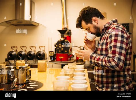 Caucasian Barista Tasting Coffee In Coffee Shop Stock Photo Alamy