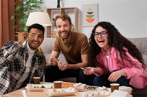 Free Photo Front View Smiley People With Sushi