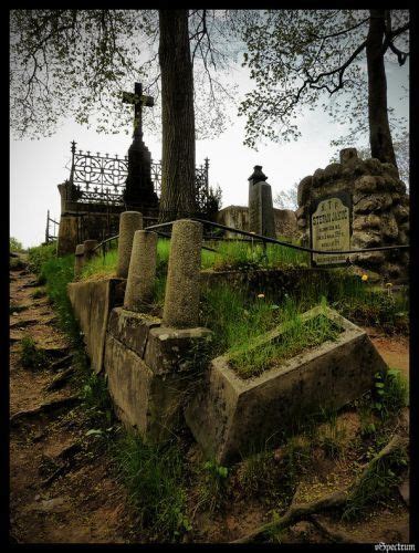 An Old Cemetery With Tombstones And Crosses