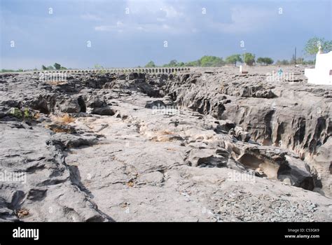 nighoj-asian largest potholes formed Stock Photo - Alamy