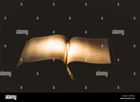 Light Shining On Open Bible Stock Photo Alamy