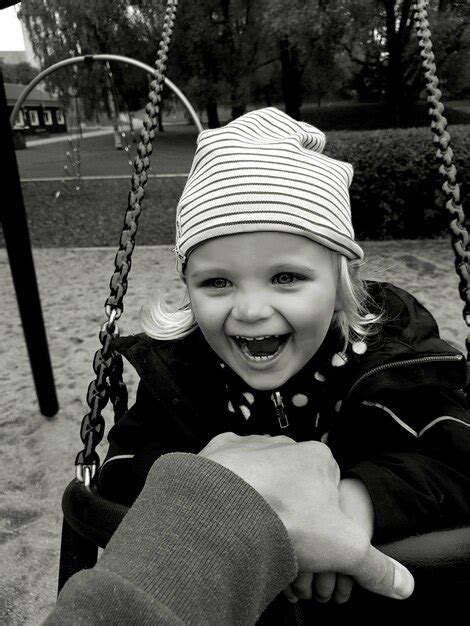 Premium Photo Portrait Of Cute Girl On Swing