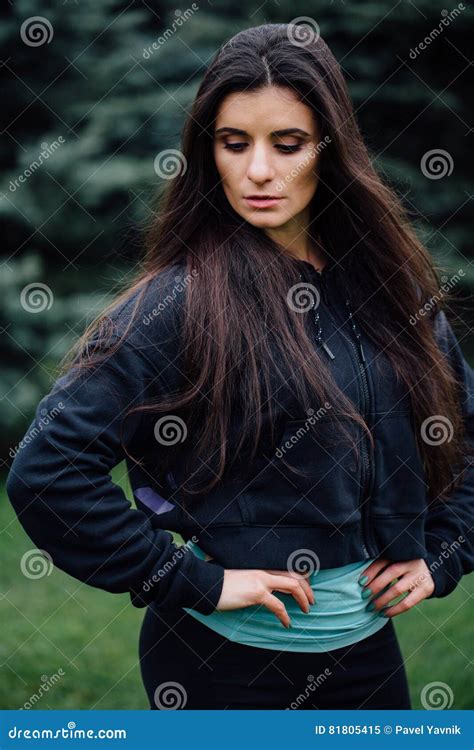 Beautiful Fitness Brunette Athlete Woman Resting Posing After Work Out Exercising At Park Stock