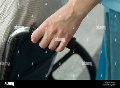 Person Pushing Wheelchair Stock Photo Alamy