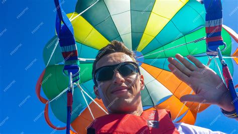 Premium Photo Parasailing With Colorful Parachute In Maldives