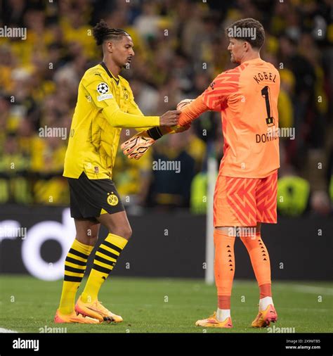 S Bastien Haller Of Borussia Dortmund And Gregor Kobel Of Borussia