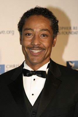 A Smiling Man In A Tuxedo And Bow Tie At An Awards Ceremony With His