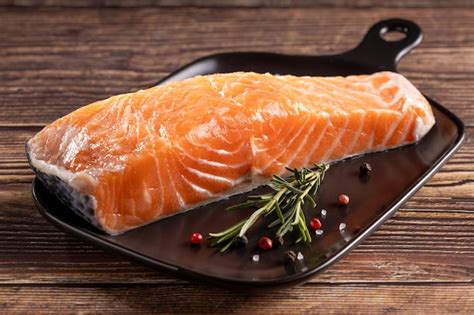 Premium Photo Fresh Raw Salmon Fillet With Ingredients For Preparation