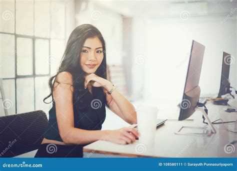 Young Attractive Smart Woman In Casual Office Outfit Sitting In Stock