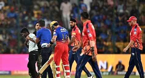 Security Brutally Beats Fan Rushing Towards Virat Kohli In Rcb Match