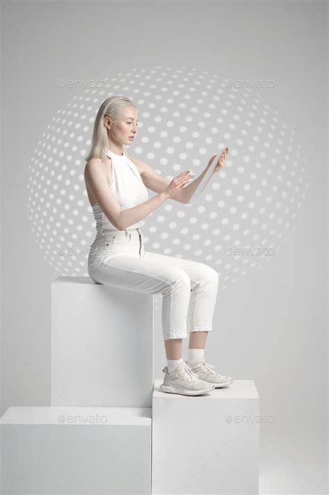 Futuristic Young Woman Sitting On Cube Stock Photo By Nomadsoul1