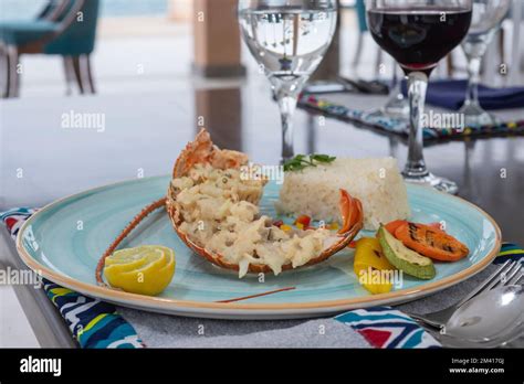 Stuffed Lobster Dish A La Carte Meal With White Rice And Vegetables At