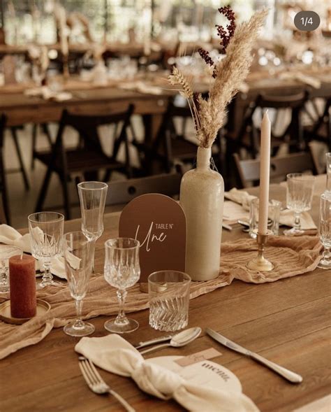 A Wooden Table Topped With Lots Of Glasses And Plates