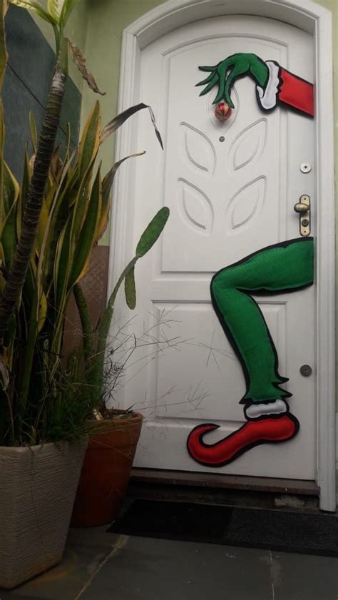 A Door Decorated With An Elf S Leg Painted On It