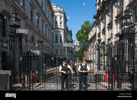 Police Officers On Duty At The Gates Of Downing Street Hi Res Stock