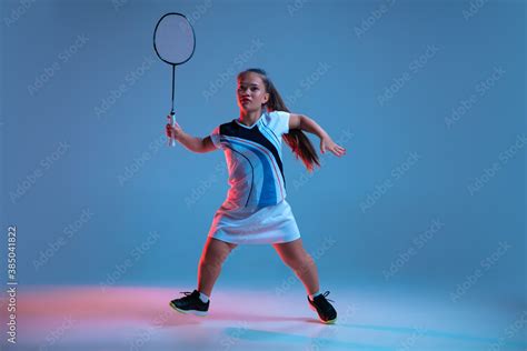 Energy Beautiful Dwarf Woman Practicing In Badminton Isolated On Blue