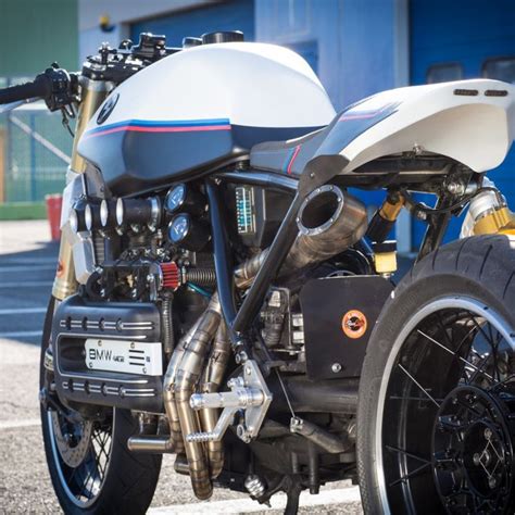 A White And Blue Motorcycle Parked In Front Of A Building