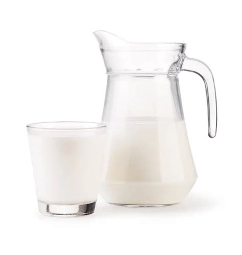 Milk jug and glass on white background — Stock Photo © Andrey_Kuzmin ...