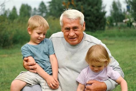 Premium Photo Grandfather And Grandchildren Have Fun During Walk In