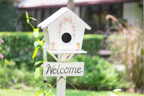 White bird house in the garden 16695614 Stock Photo at Vecteezy