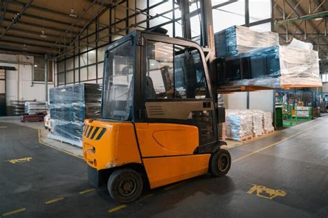 Premium Photo Forklift Loader In Storage Warehouse Shipyard