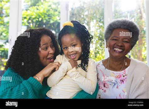 Happy African American Mother Daughter And Granddaughter Embracing On