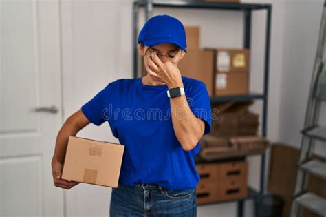 Middle Age Brunette Woman Working Wearing Delivery Uniform And Cap
