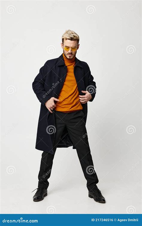 Fashionable Man In Dark Clothes Orange Sweater And Pants Suit Model