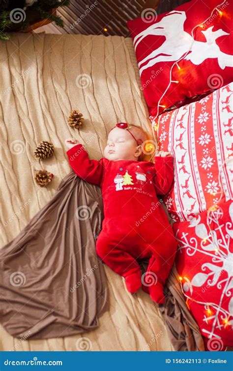 Cute Newborn Baby In A Christmas Costume On A Bed At Home Stock Image