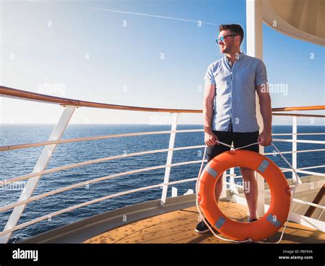 Male Hand Holding Orange Lifebuoy Stock Photo Alamy