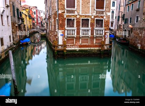 Canal in Venice with traditional old houses, Italy Stock Photo - Alamy