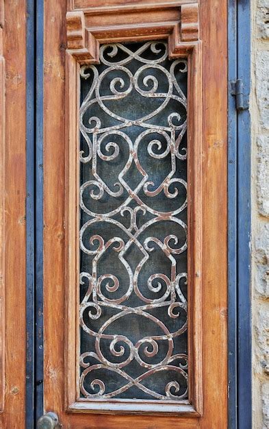 Premium Photo Wooden Door With Metal Bars In Old Jaffa