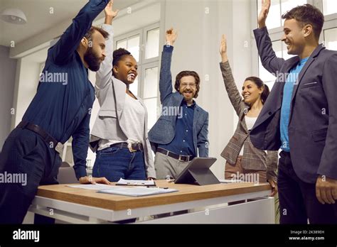 Happy Diverse Business Team Celebrating Success And Having Fun In A