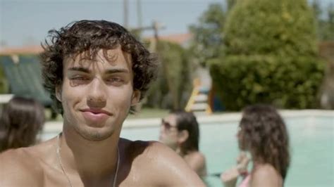 Front View Of Man With Naked Torso Standing In Swimming Pool Stock