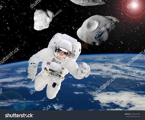 Astronaut Asteroids Above Earth Elements This Stock Photo 1383223739