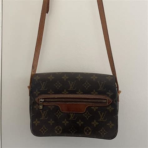 Louis Vuitton crossbody. Zipper opens but is sticky... - Depop