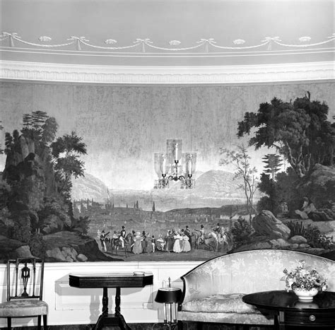 An Ornately Decorated Room With Chairs And Paintings On The Wall