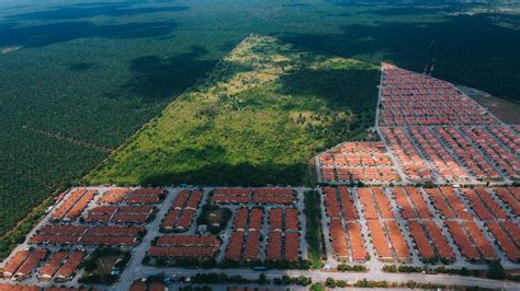 Birds Eye View of Suburbs Against a Rural Landscape · Free Stock Photo