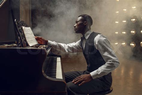 Ebony pianist, jazz performer on the stage | Stock image | Colourbox