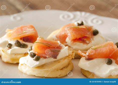 A Plate Of Smoked Salmon And Cream Cheese Blini Canapes Stock Image