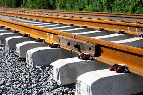 Premium Photo Rusty Intermediate Rail Fasteners On Concrete Sleepers