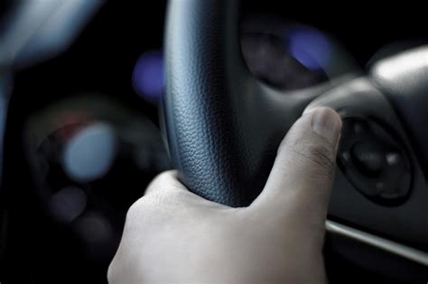 Premium Photo Cropped Hand Holding Steering Wheel In Car