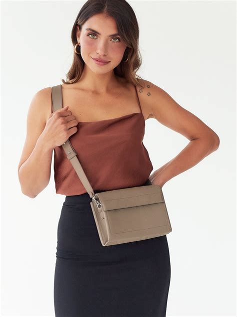 A Miniature Cross Body Bag In A Strict Minimalist Style Style Fashion Trending Outfits