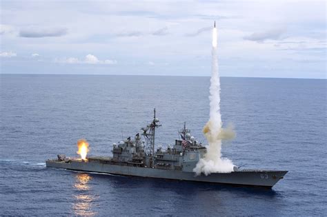 USS Cowpens (CG 63) fires a Standard Missiles (SM) 2 at an airborne ...