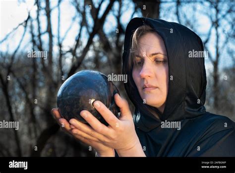 Hooded Woman In Black Robes Deep In The Forest Witches Halloween And