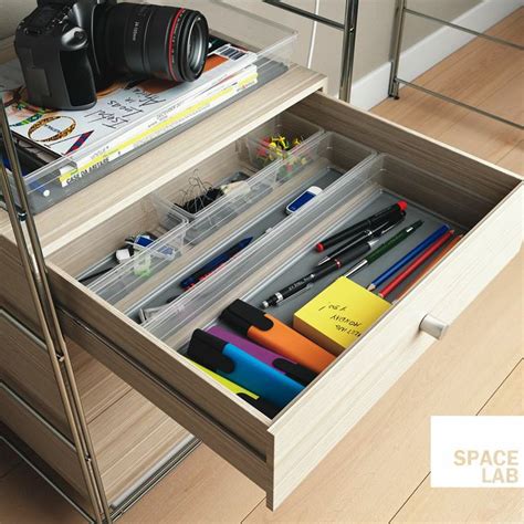 An Open Drawer With Pens Pencils Markers And Other Office Supplies In It