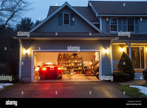 Open Garage Doors In A Suburban Home Usa Stock Photo Alamy