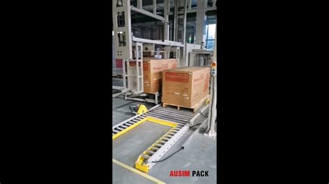 Automated Pallet Packaging System With Strapping Wrapping And