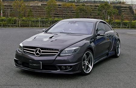 A Black Mercedes Cls Parked In A Parking Lot